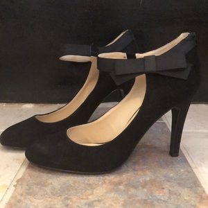 Black heels with ankle strap bow